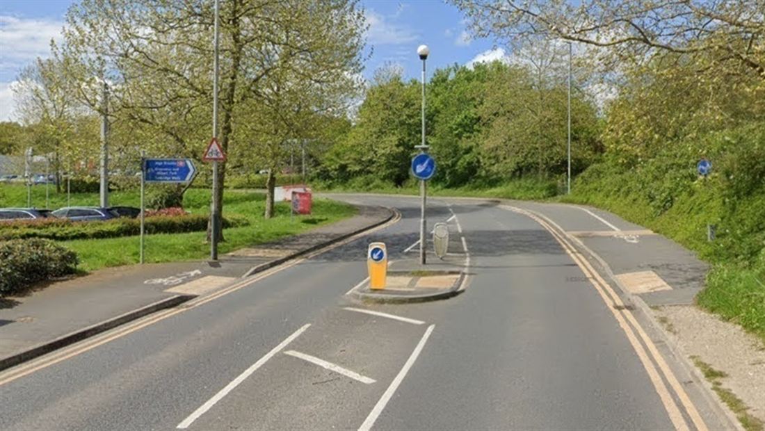 A section of the Tunbridge Wells cycle route, showing the shared-use path, cycle route signage and the central refuge island.